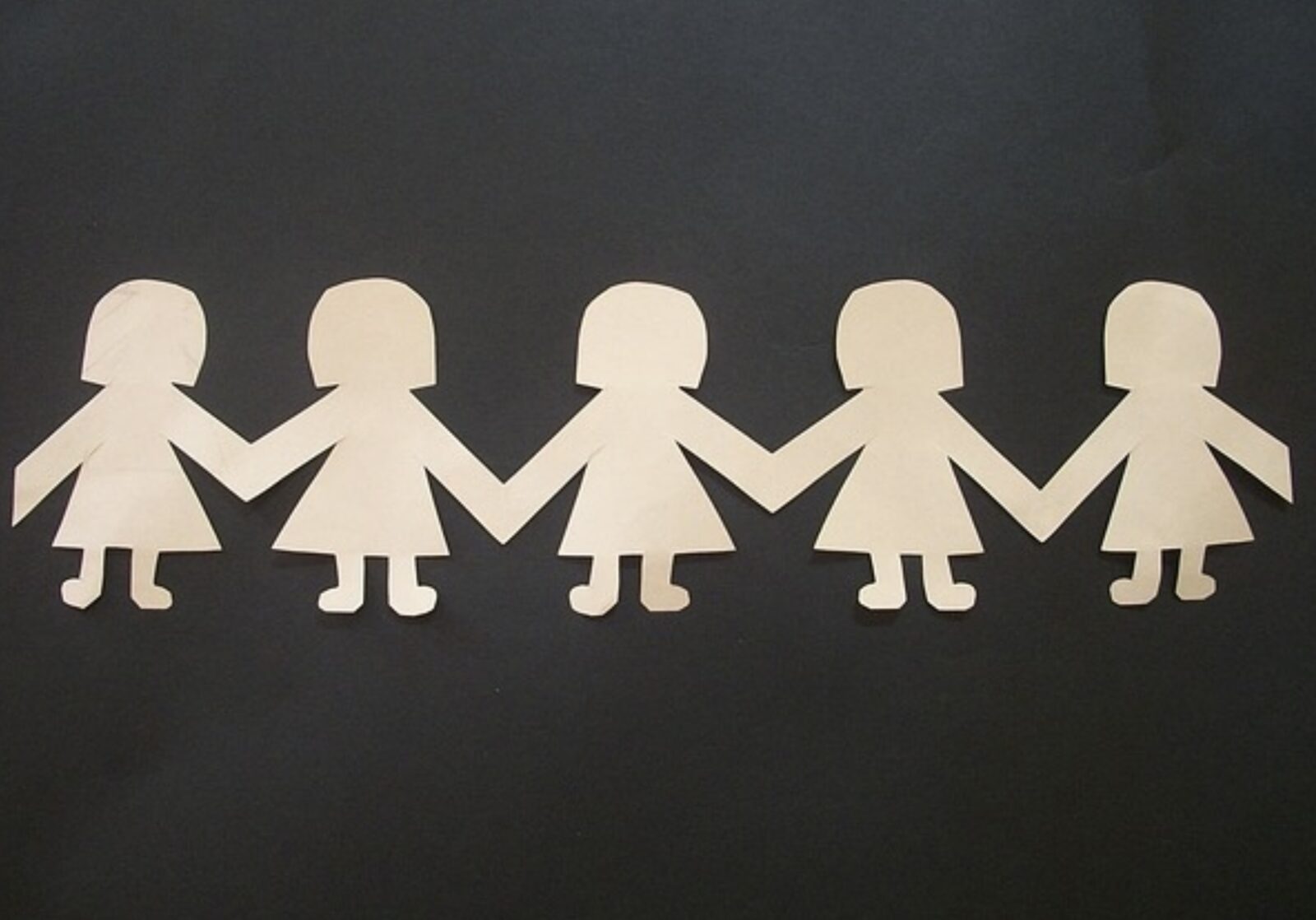 row of 5 paper dolls