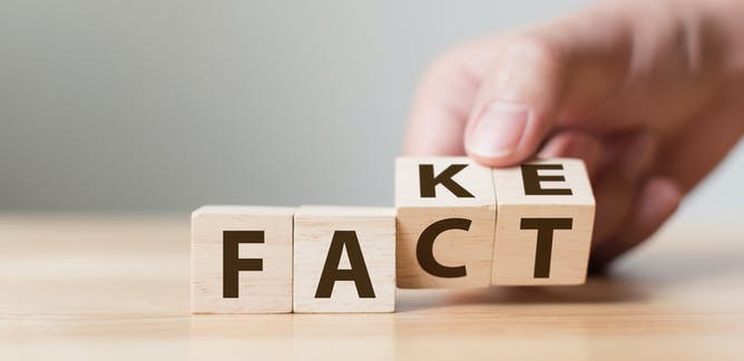 Letter blocks that change from FACT to FAKE