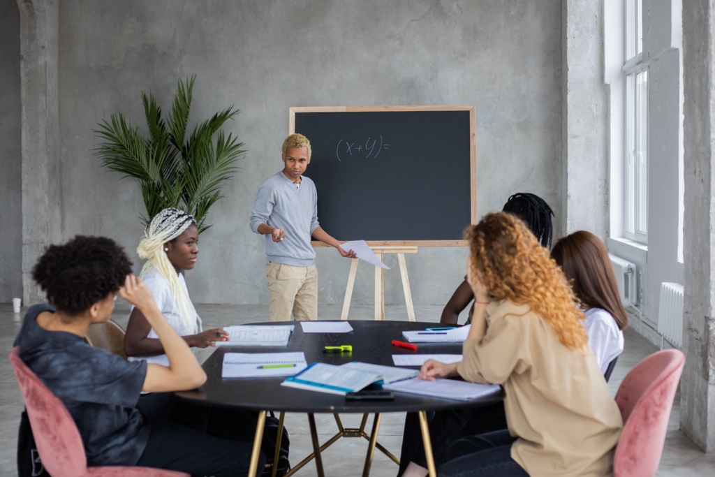 Person teaching at chalkboard