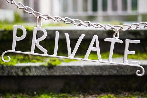 private sign hanging from chain