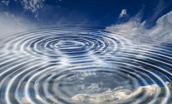Ripples in water reflecting sky